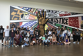 YTI summer academy students standing with mural at National Center for Civil and Human Rights