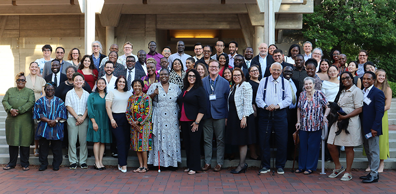 a large, diverse group of people posing for a picture